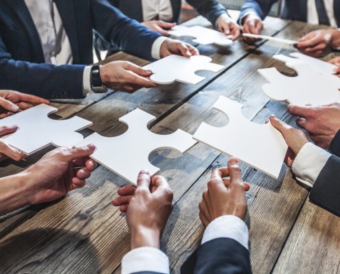 Business people and puzzle